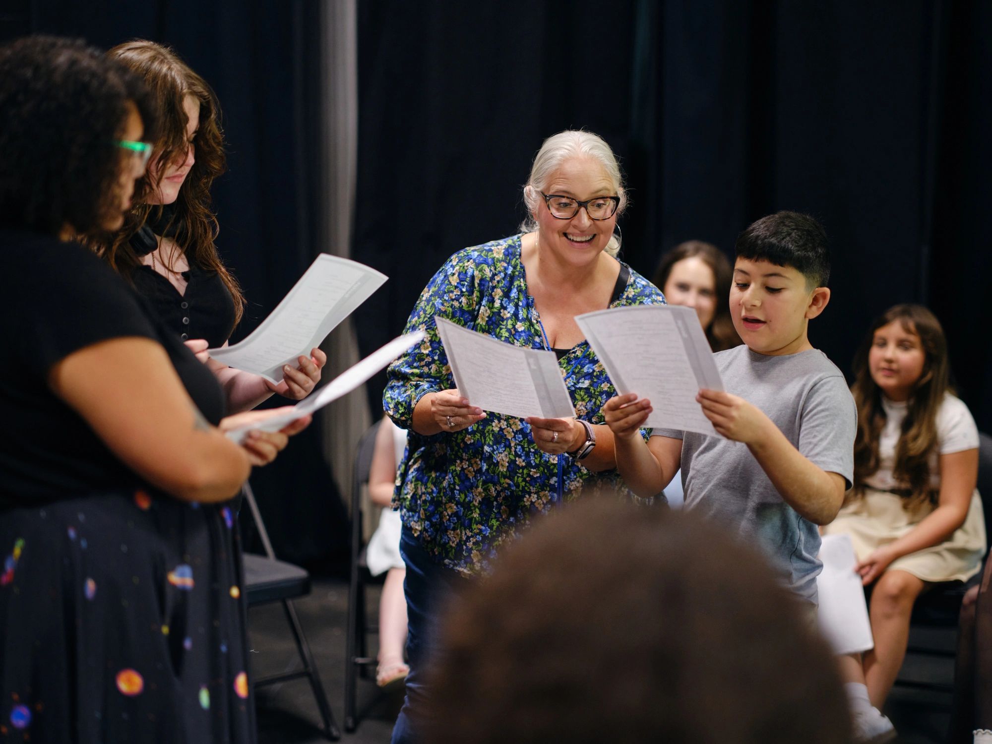 Young performers rehearsing a theater scene