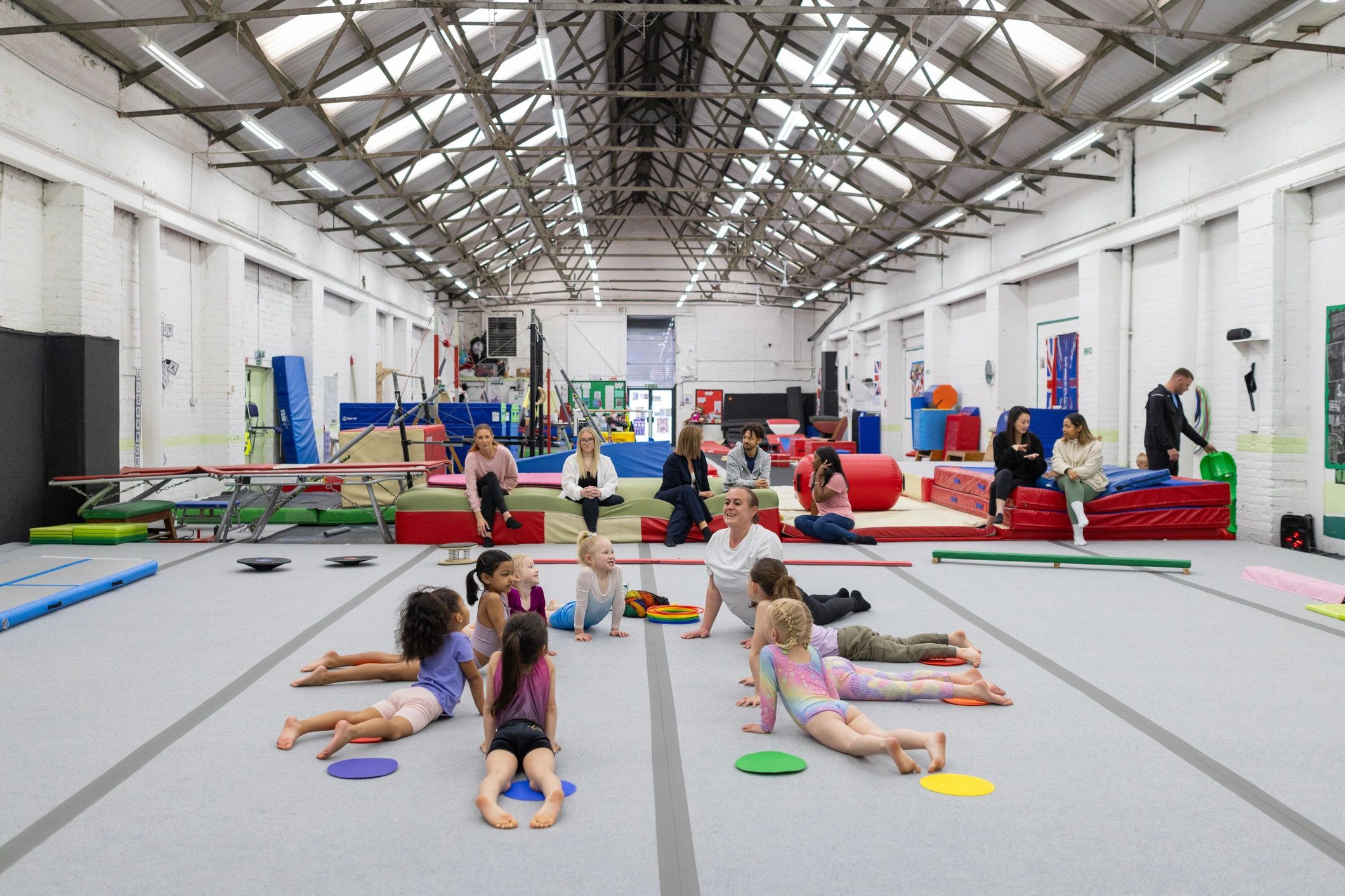 Children learning movement together in a class